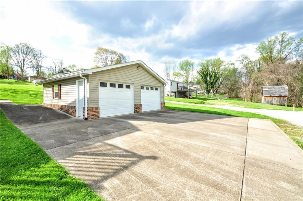 215 Bull Run Road Brownsville, PA 15417 - Photo 3 of 31 a view of a house with a yard and plants