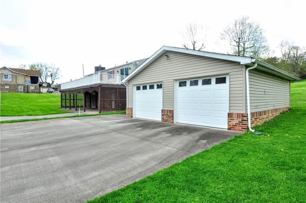 215 Bull Run Road Brownsville, PA 15417 - Photo 4 of 31 a view of a house with a yard and garage