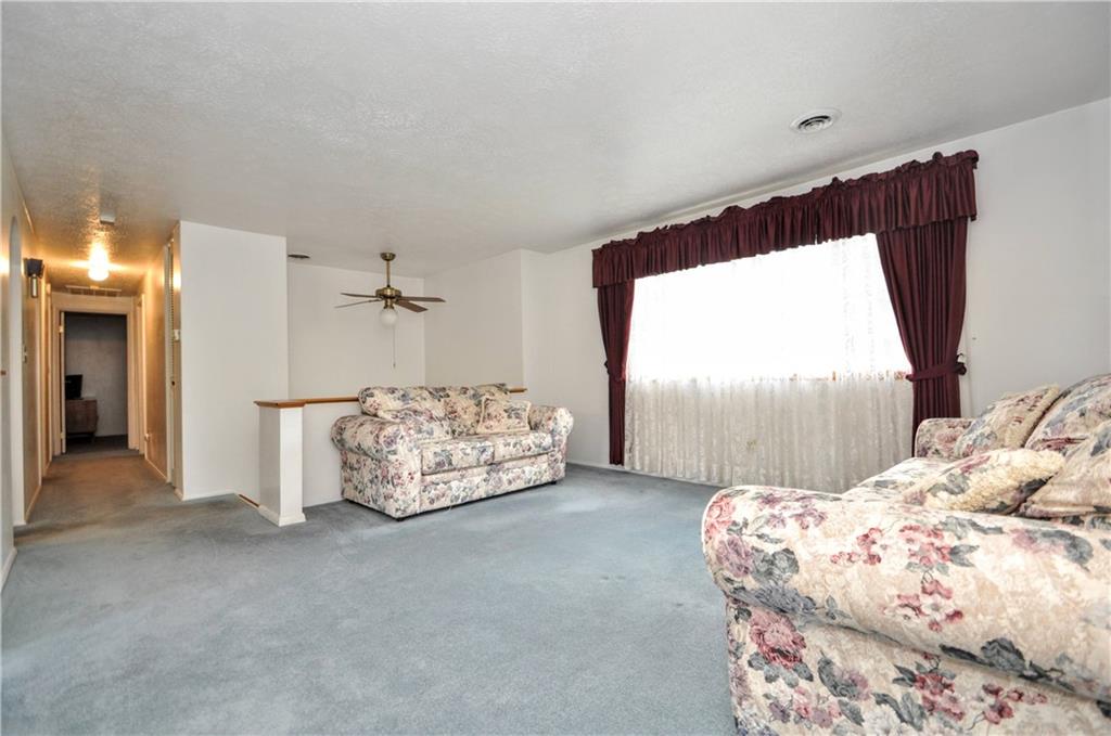 215 Bull Run Road Brownsville, PA 15417 - Photo 7 of 31 a spacious bedroom with a bed and a couch