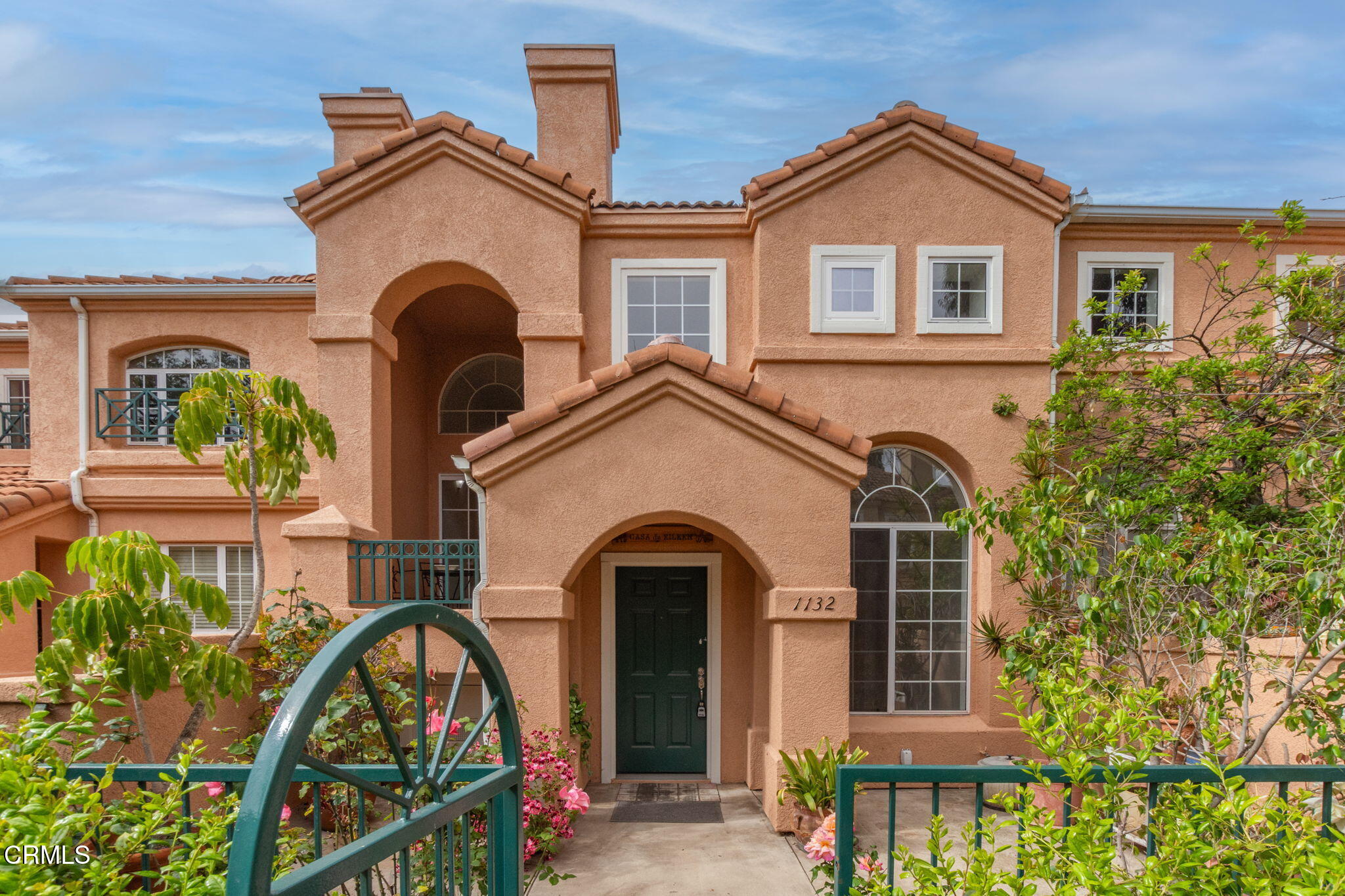 1132 Mooring Walk Oxnard, CA 93030 - Photo 1 of 30 a front view of a house with a garden