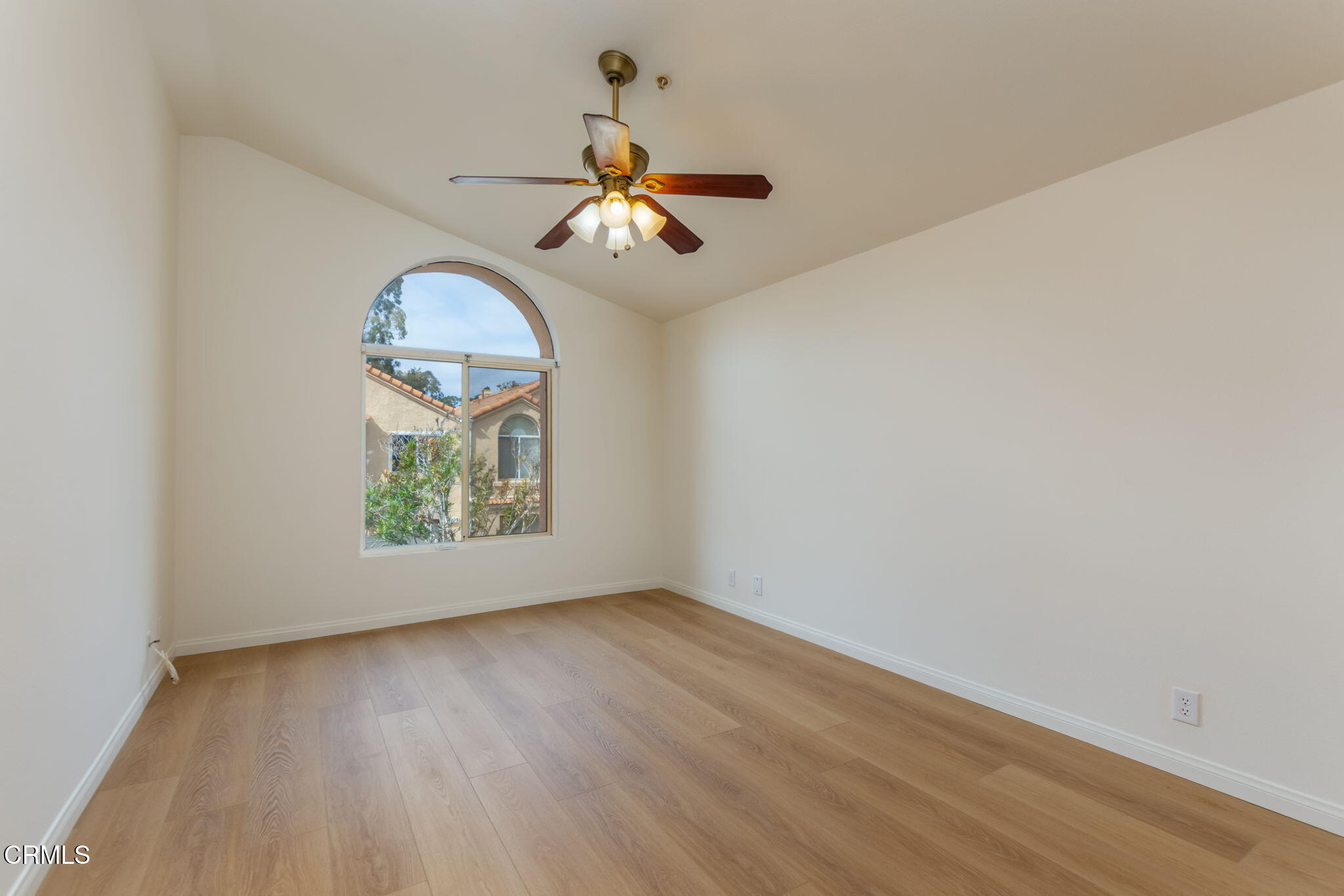 1132 Mooring Walk Oxnard, CA 93030 - Photo 12 of 30 an empty room with wooden floor chandelier fan and windows