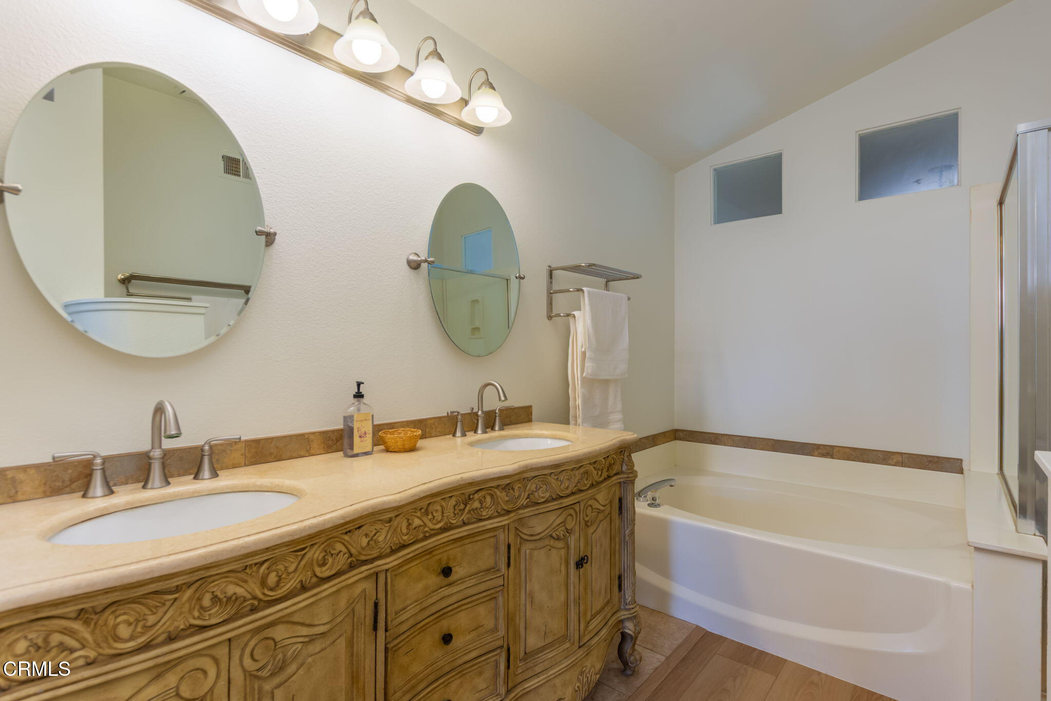 1132 Mooring Walk Oxnard, CA 93030 - Photo 13 of 30 a bathroom with a tub sink and mirror
