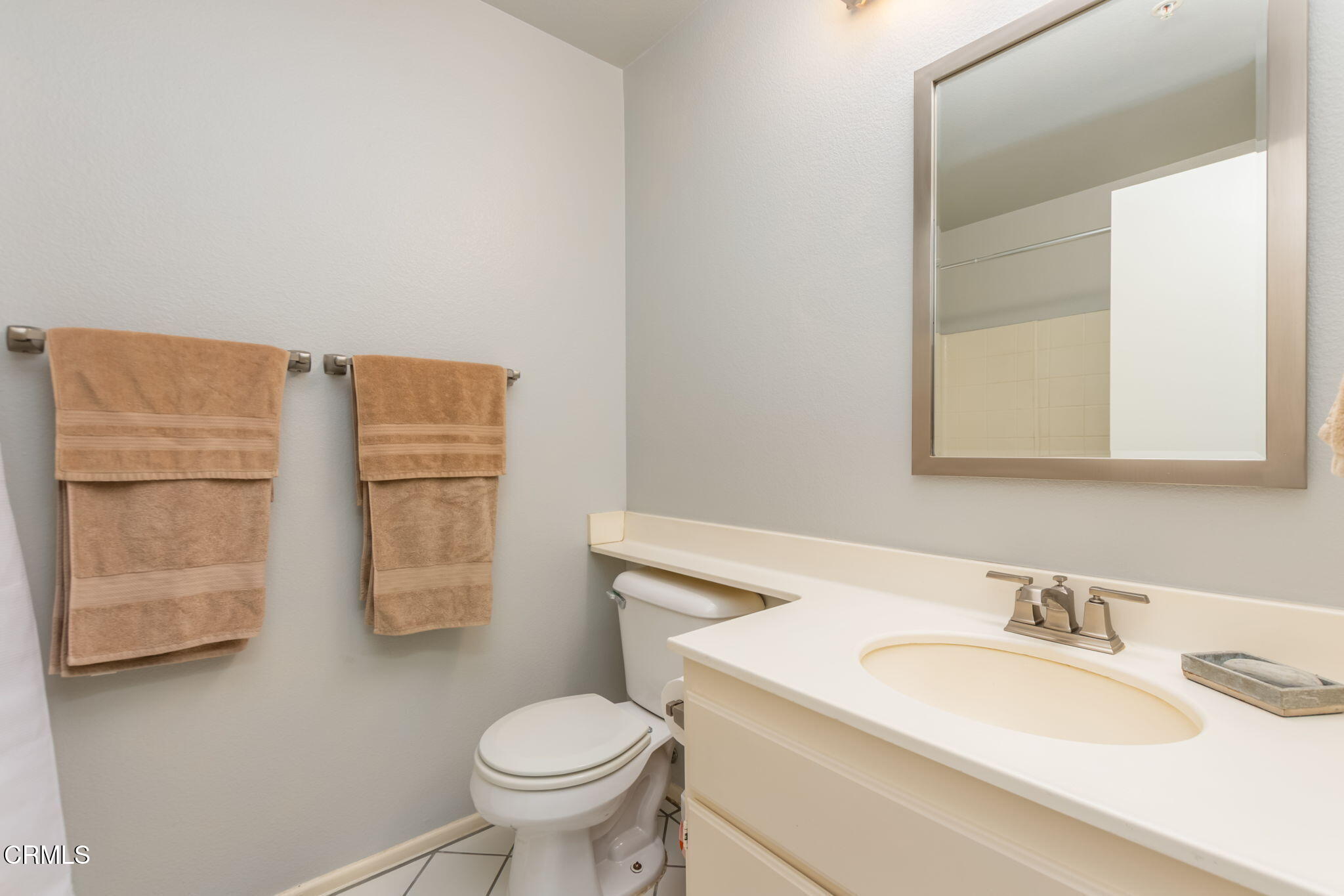 1132 Mooring Walk Oxnard, CA 93030 - Photo 17 of 30 a bathroom with a granite countertop sink toilet and mirror
