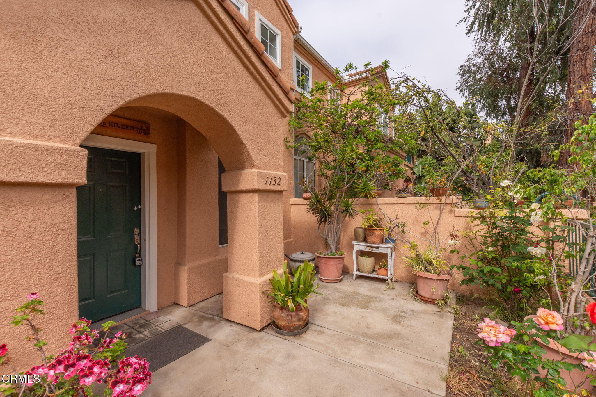 1132 Mooring Walk Oxnard, CA 93030 - Photo 21 of 30 a front view of a house with outdoor seating and plants