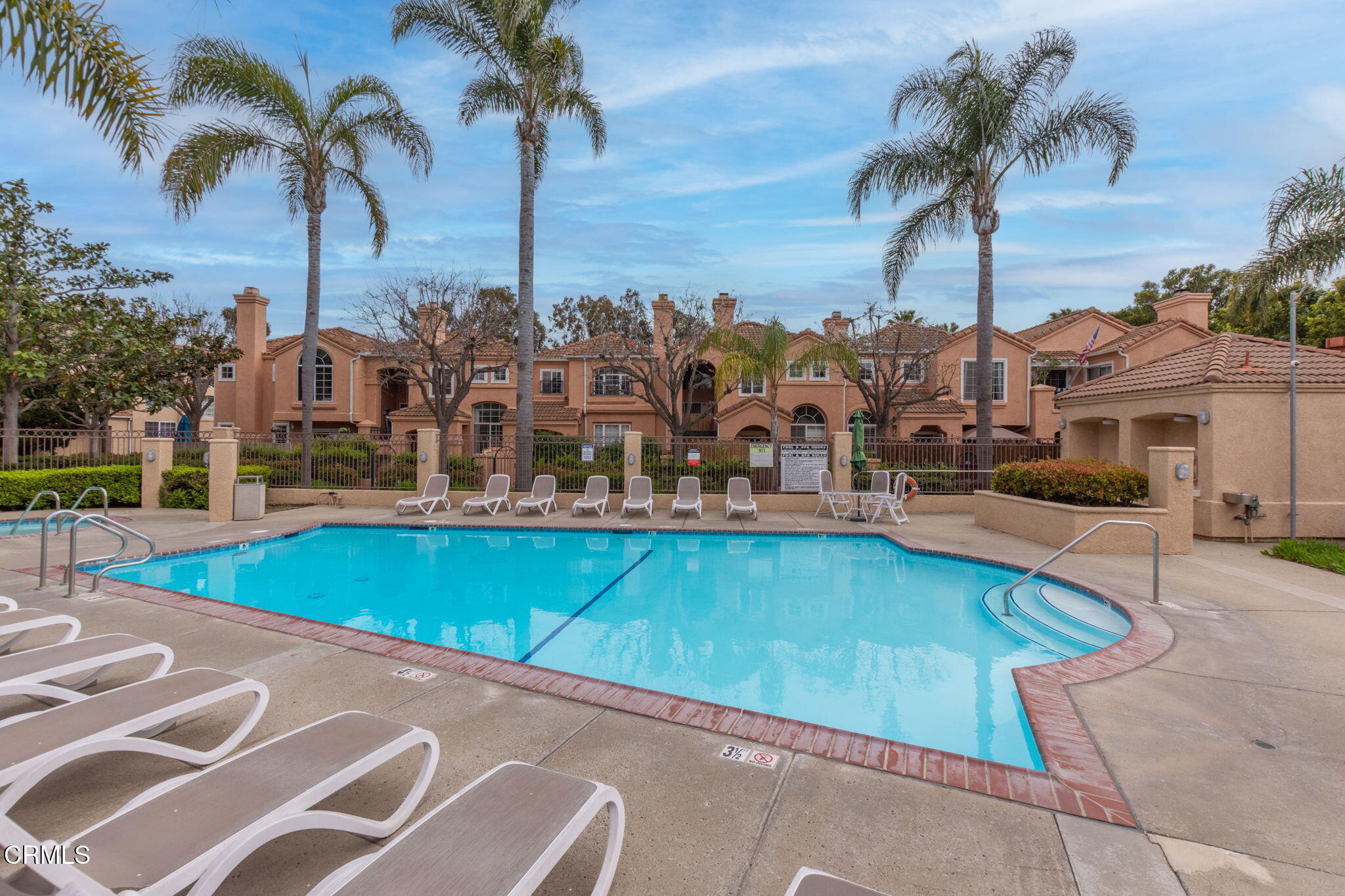 1132 Mooring Walk Oxnard, CA 93030 - Photo 23 of 30 a view of a swimming pool with a table and chairs