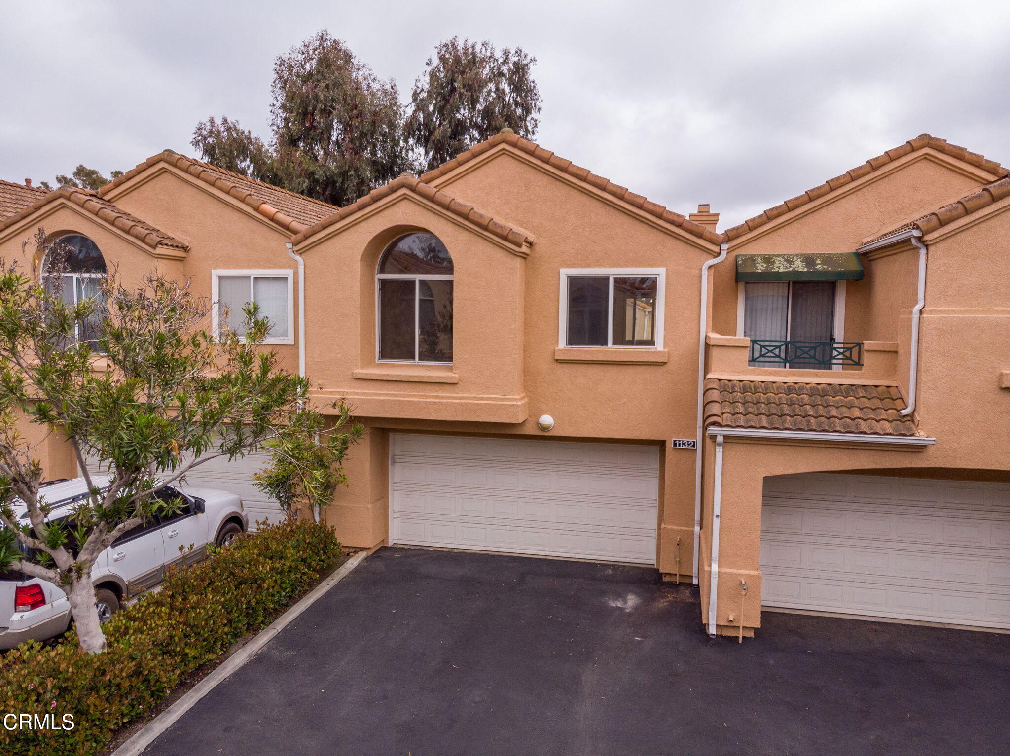 1132 Mooring Walk Oxnard, CA 93030 - Photo 27 of 30 a front view of a house with a garage