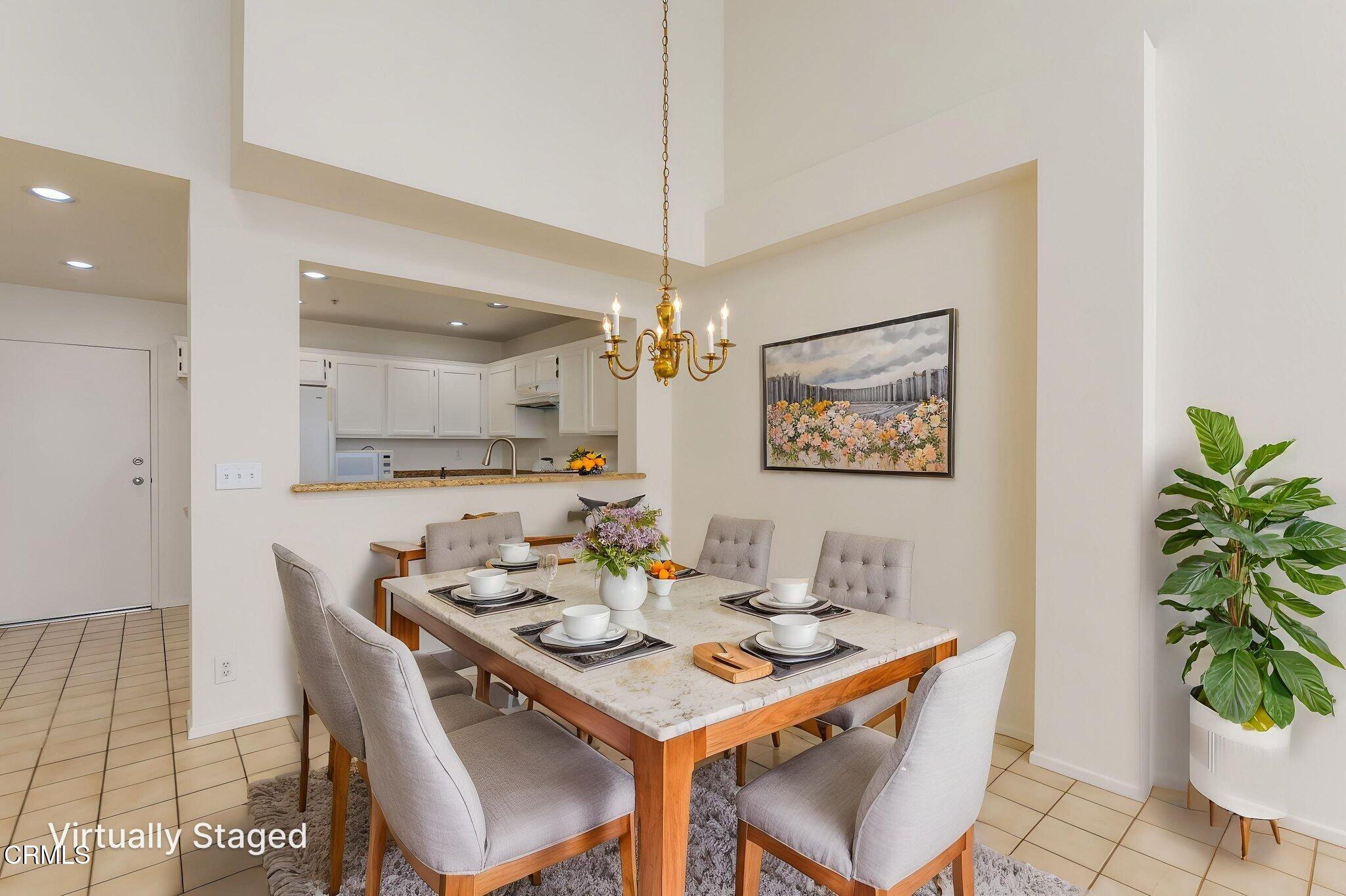 1132 Mooring Walk Oxnard, CA 93030 - Photo 5 of 30 a dining room with furniture potted plants and kitchen view