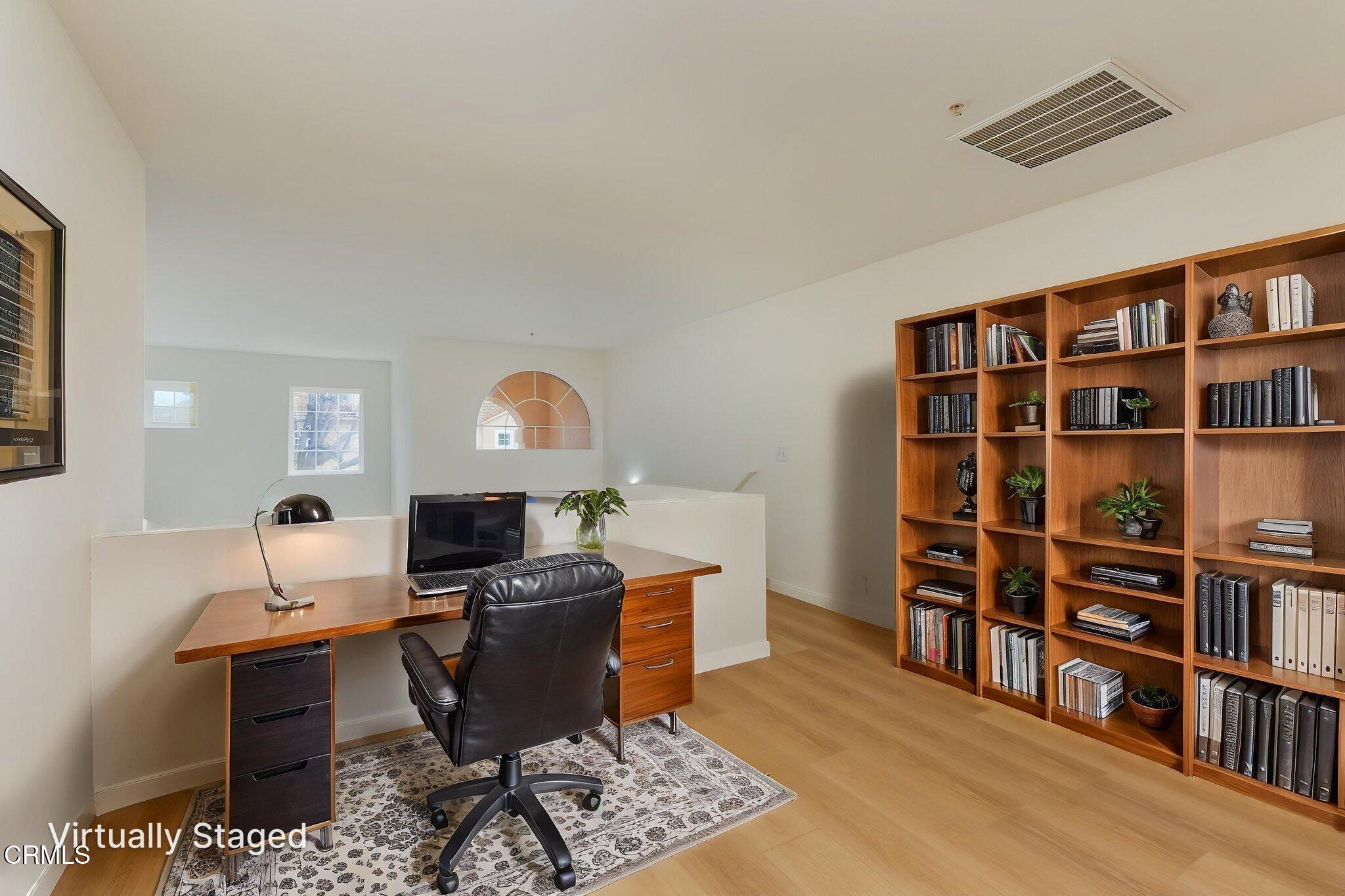 1132 Mooring Walk Oxnard, CA 93030 - Photo 9 of 30 a workspace with a bookshelf
