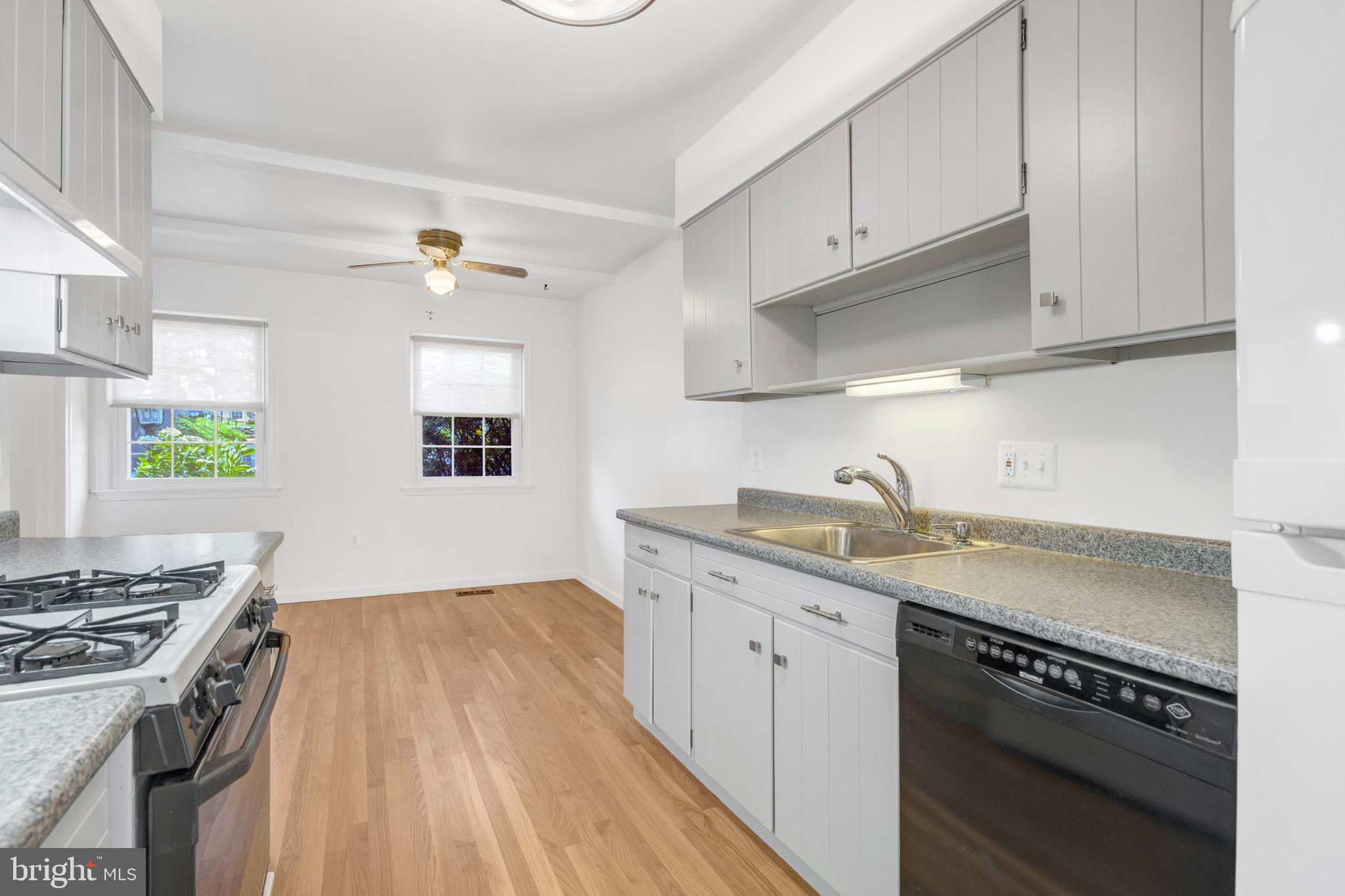 3221 Adams Court Fairfax, VA 22030 - Photo 11 of 51 a kitchen with stainless steel appliances granite countertop a sink stove and cabinets