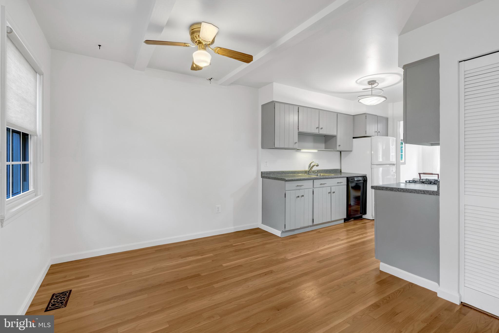 3221 Adams Court Fairfax, VA 22030 - Photo 12 of 51 a kitchen with a sink cabinets and wooden floor