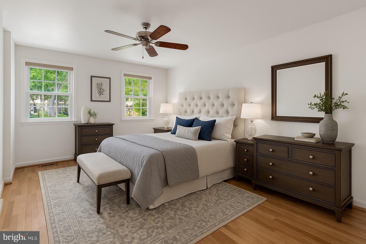 3221 Adams Court Fairfax, VA 22030 - Photo 15 of 51 a bedroom with a bed and a dresser next to a window