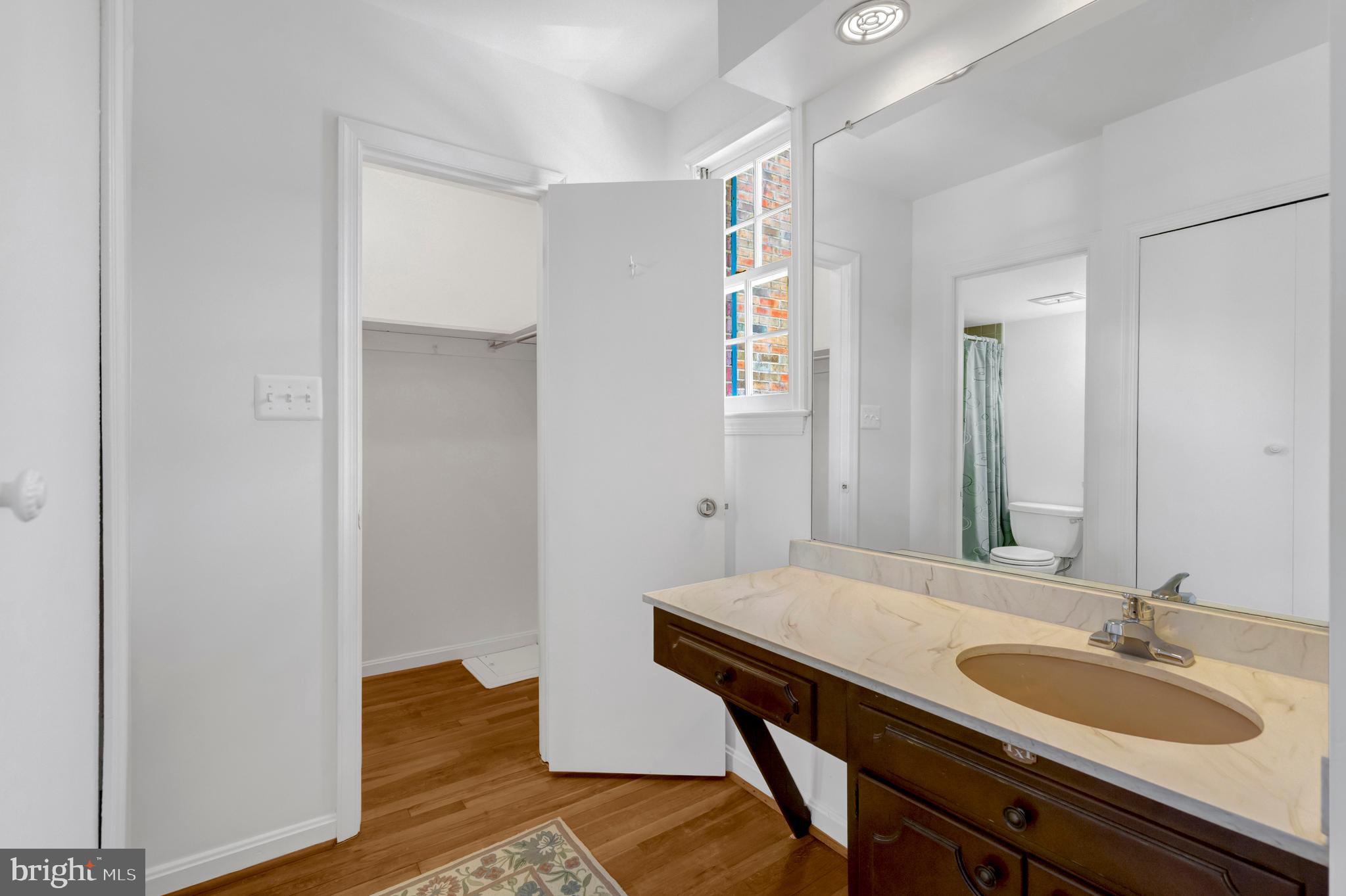 3221 Adams Court Fairfax, VA 22030 - Photo 18 of 51 a bathroom with a sink and a mirror