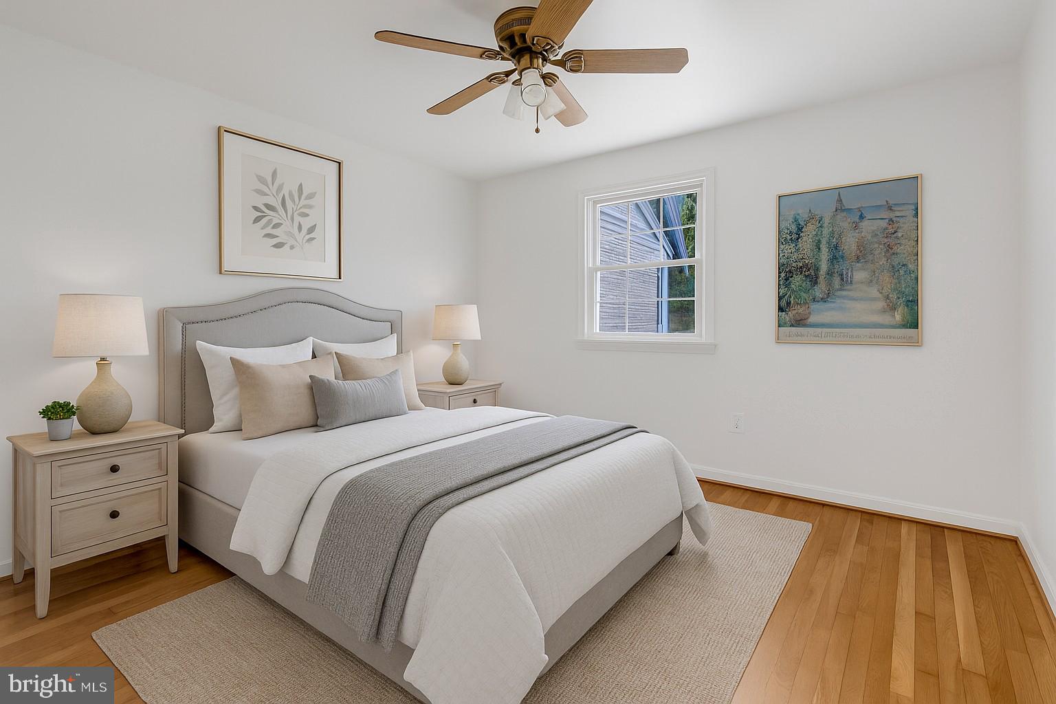 3221 Adams Court Fairfax, VA 22030 - Photo 21 of 51 a bedroom with bed and painting on the wall