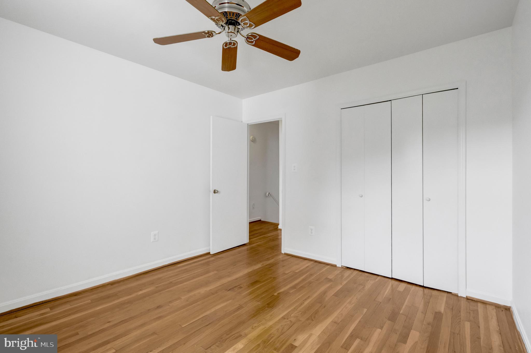 3221 Adams Court Fairfax, VA 22030 - Photo 22 of 51 a view of an empty room with wooden floor
