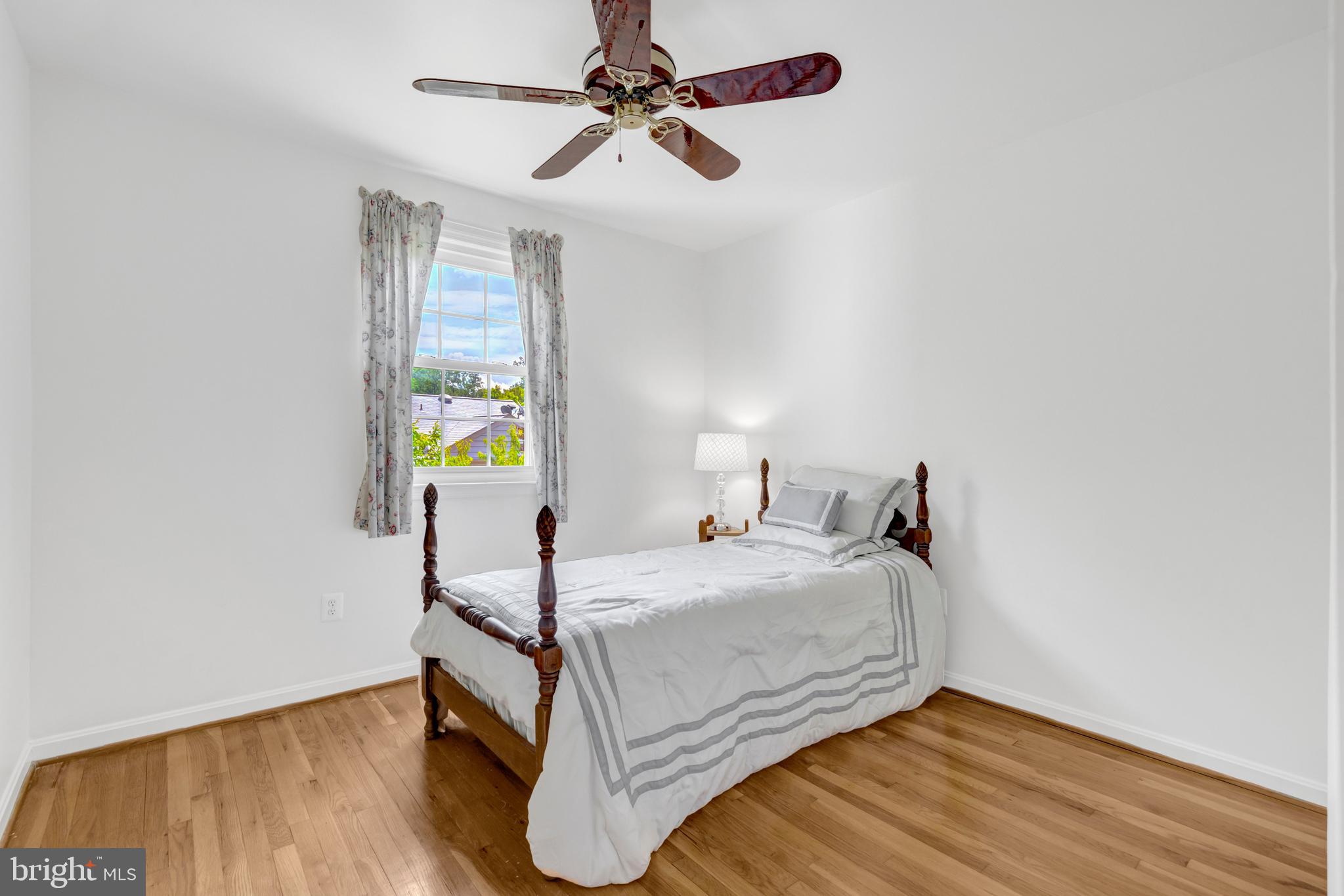 3221 Adams Court Fairfax, VA 22030 - Photo 23 of 51 a bedroom with a bed and wooden floor