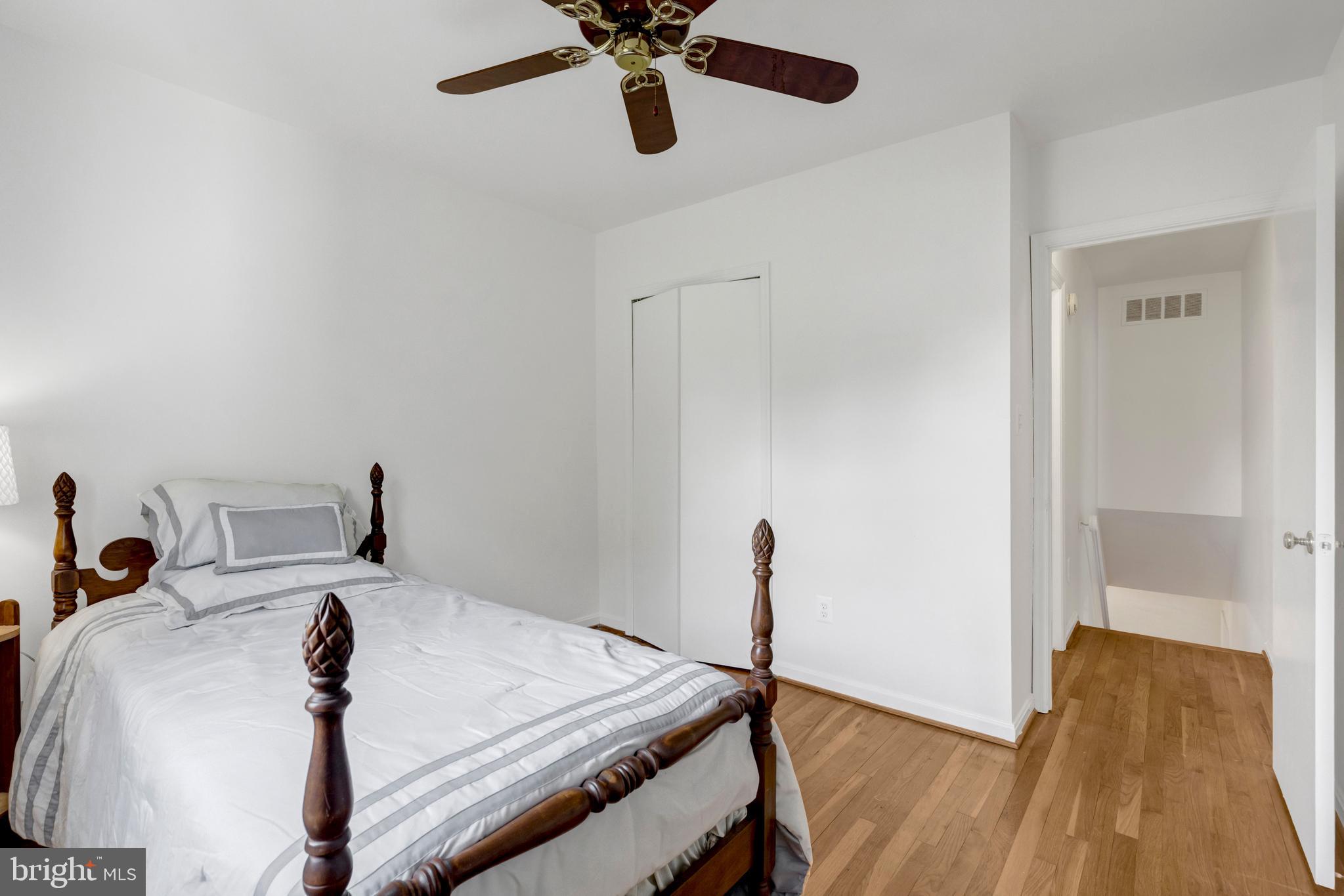 3221 Adams Court Fairfax, VA 22030 - Photo 24 of 51 a bed room with a bed and a chandelier