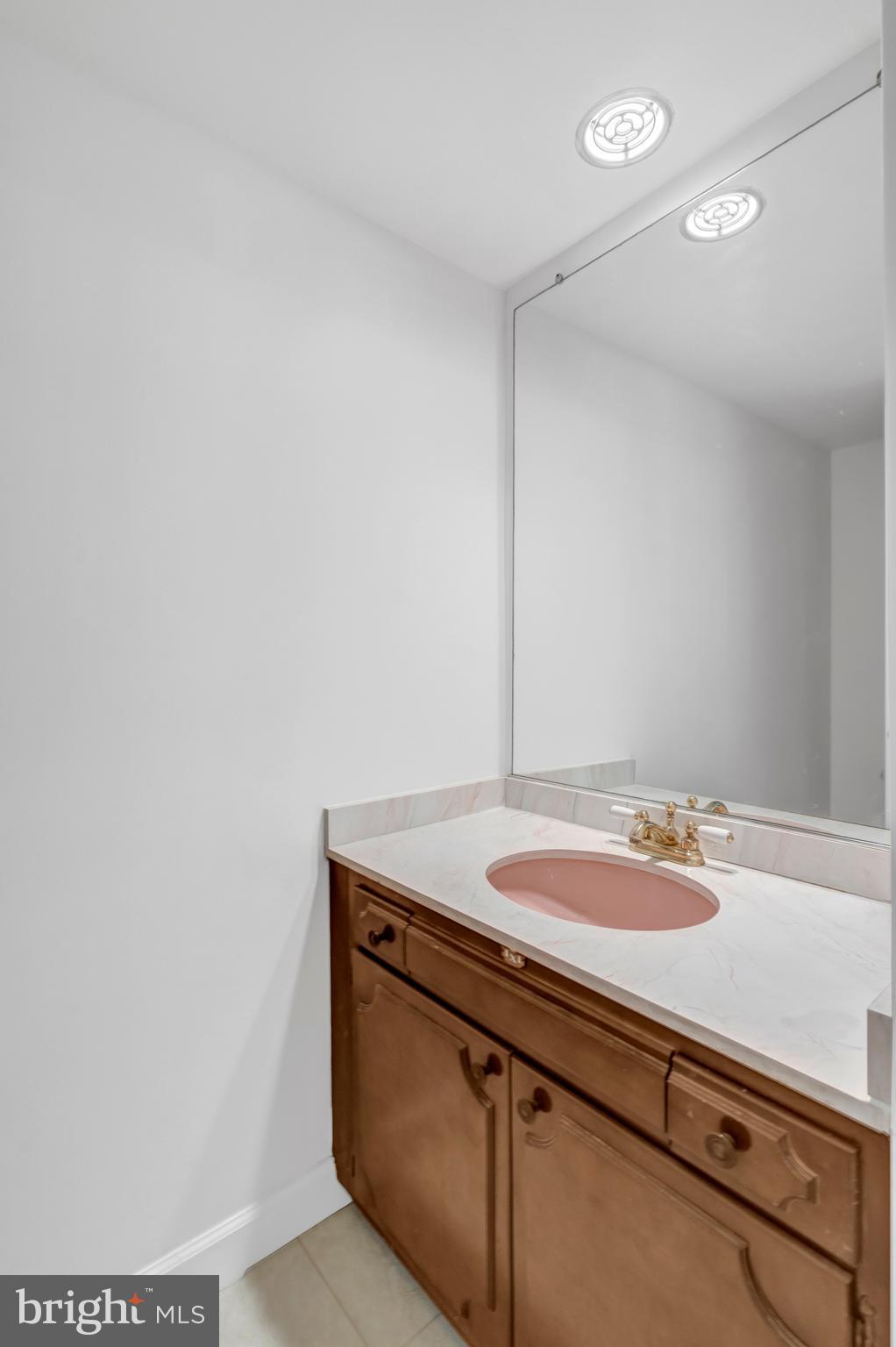 3221 Adams Court Fairfax, VA 22030 - Photo 29 of 51 a bathroom with a sink and a mirror