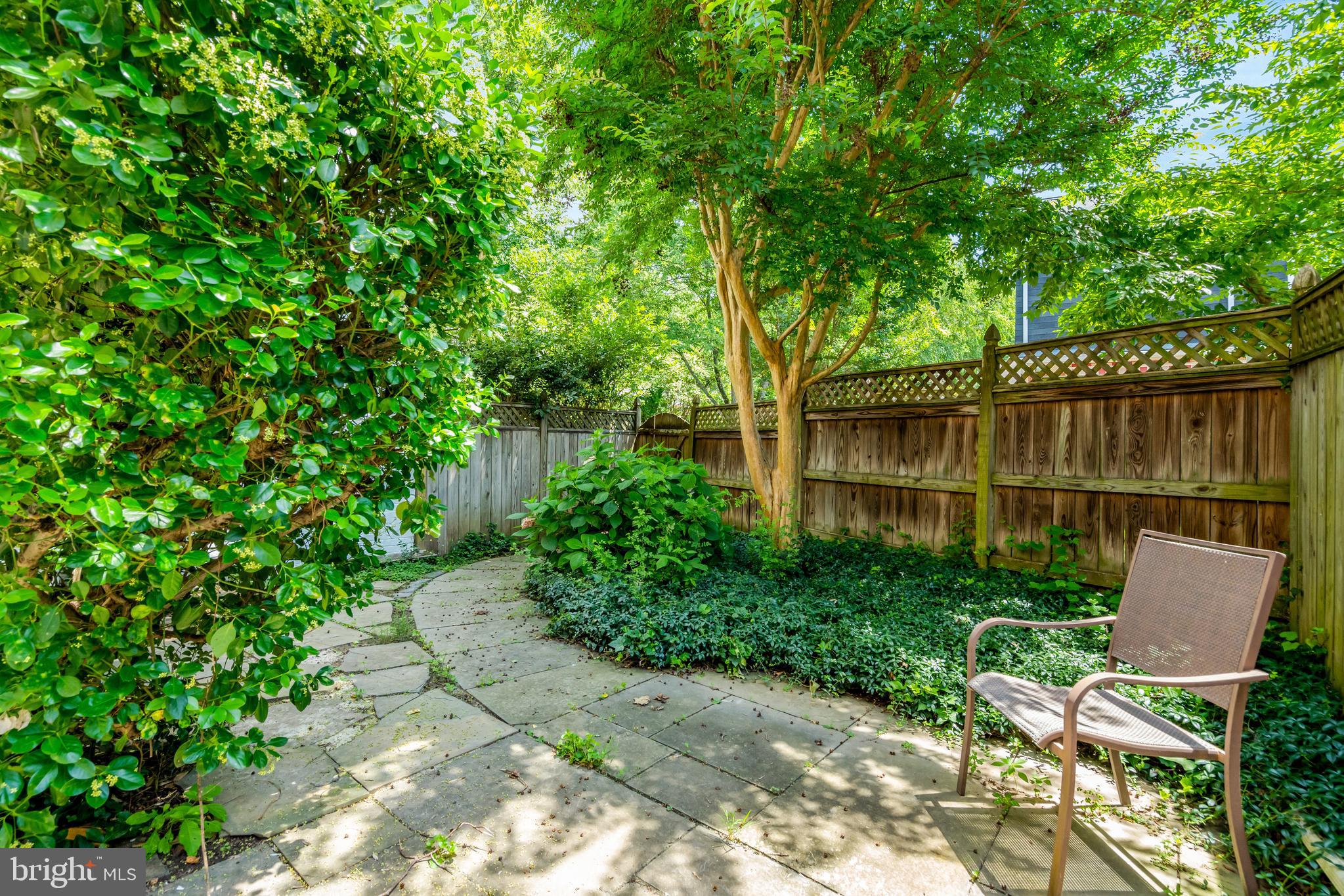 3221 Adams Court Fairfax, VA 22030 - Photo 37 of 51 a view of a chair and table in backyard of the house