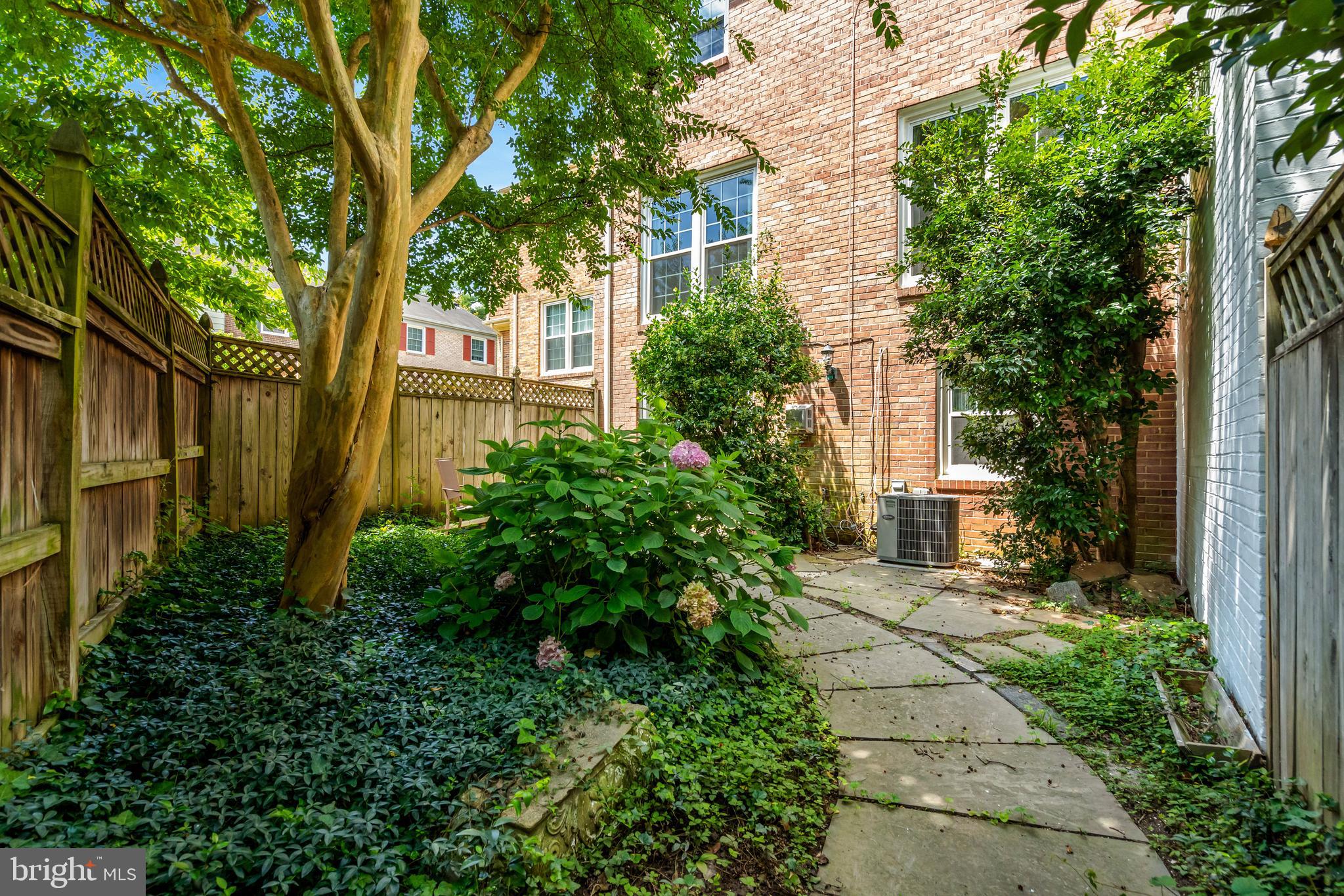 3221 Adams Court Fairfax, VA 22030 - Photo 38 of 51 front view of a house with a garden