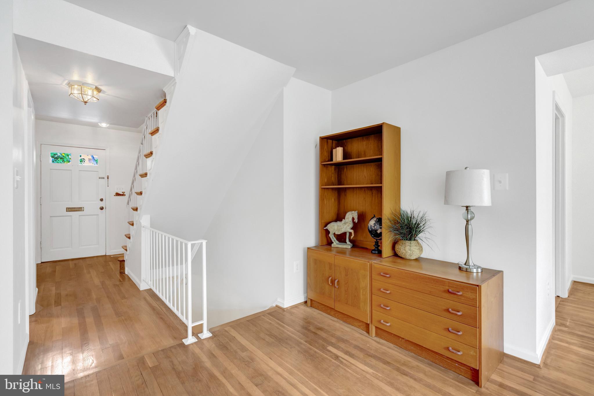3221 Adams Court Fairfax, VA 22030 - Photo 7 of 51 a view of a room that has a bed and a dresser in it