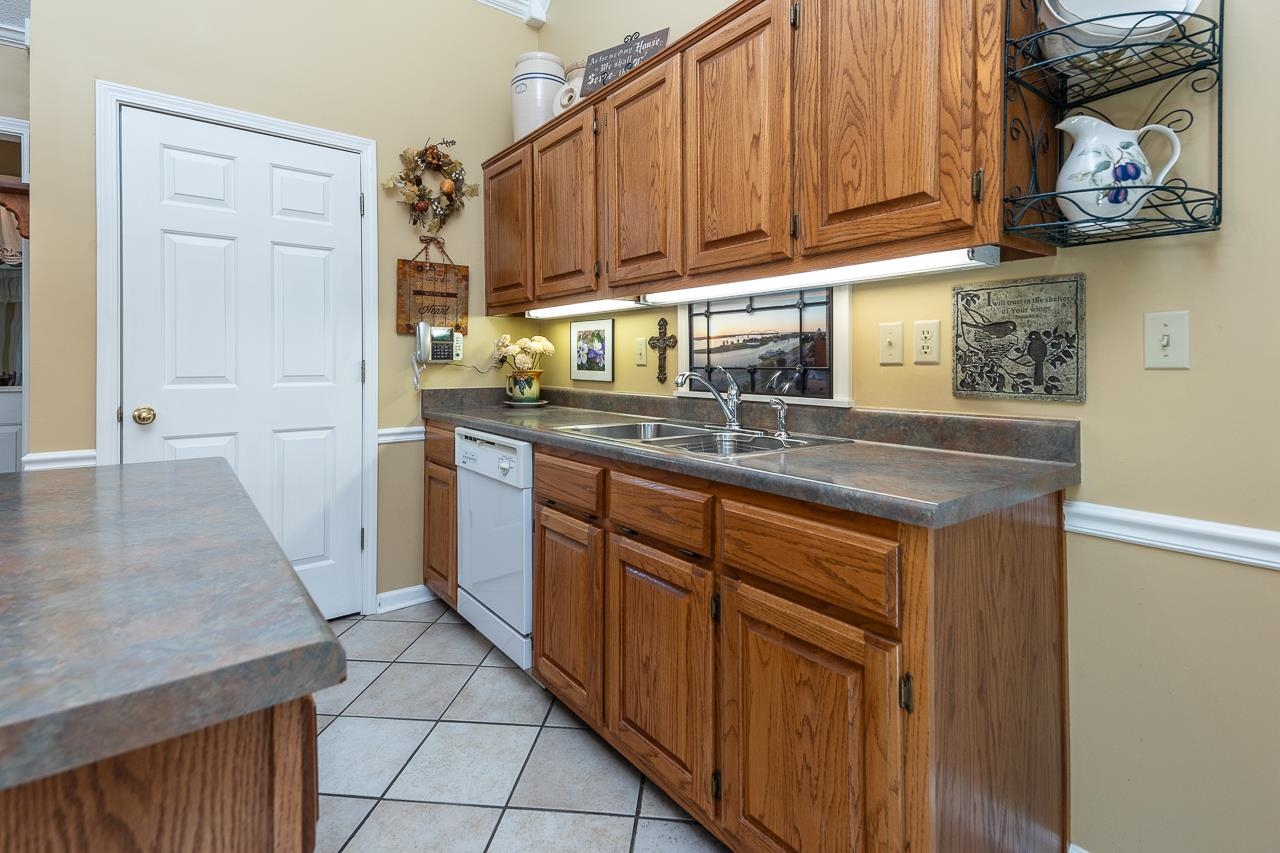 4600 Shadow Field Lane Bartlett, TN 38002 - Photo 15 of 33 a kitchen with stainless steel appliances granite countertop a sink stove and cabinets