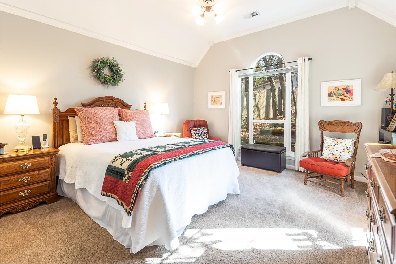 4600 Shadow Field Lane Bartlett, TN 38002 - Photo 19 of 33 a spacious bedroom with a bed and a chandelier