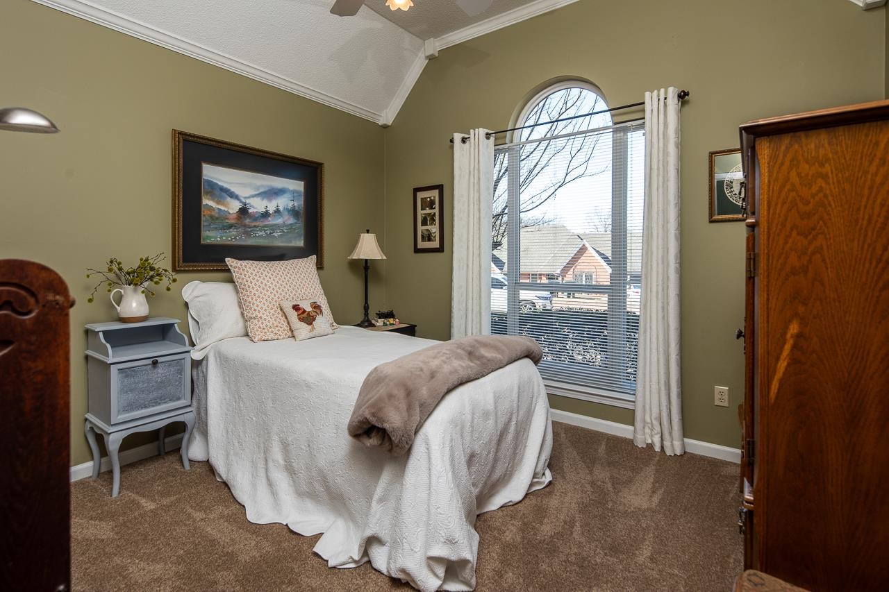 4600 Shadow Field Lane Bartlett, TN 38002 - Photo 22 of 33 a bedroom with a bed and a mirror