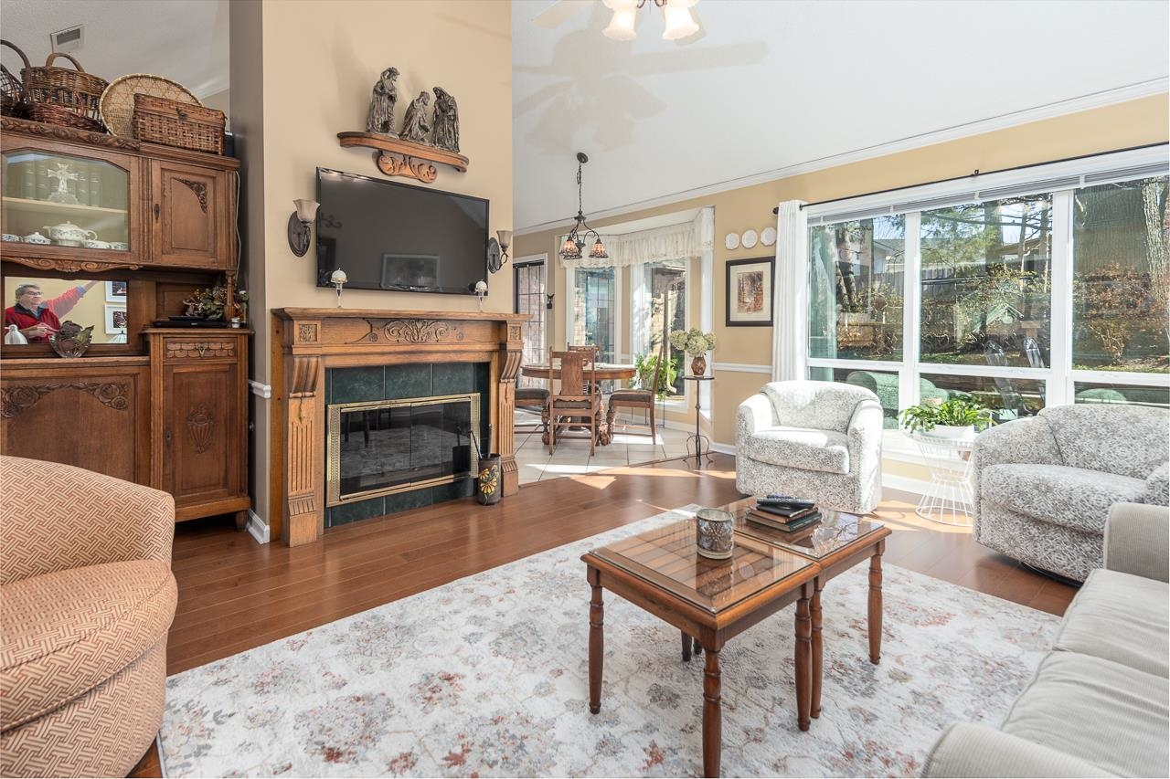 4600 Shadow Field Lane Bartlett, TN 38002 - Photo 8 of 33 a living room with furniture a flat screen tv and a fireplace