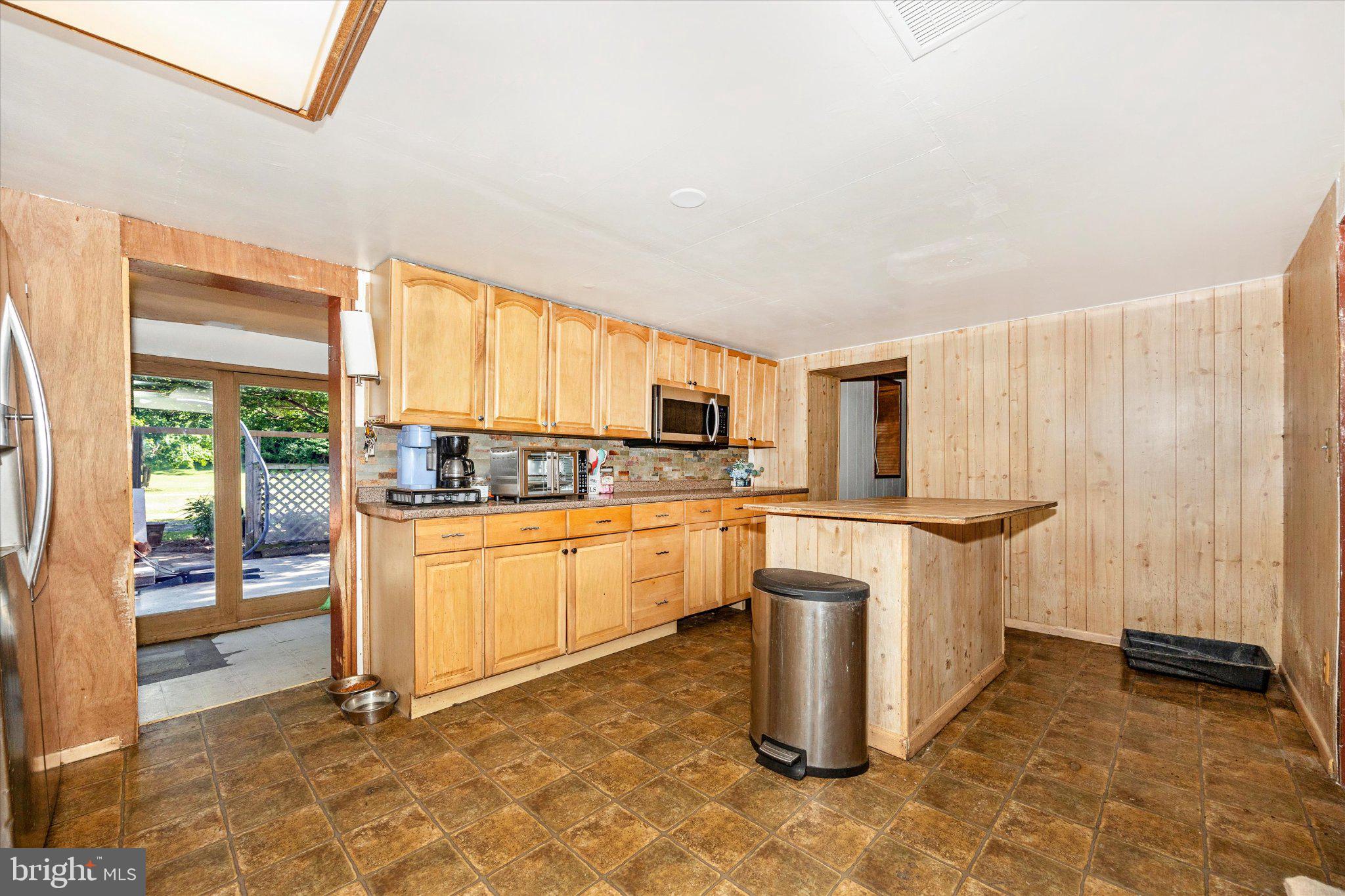 14721 Albert Staub Road Thurmont, MD 21788 - Photo 6 of 46 a kitchen with a refrigerator and white cabinets
