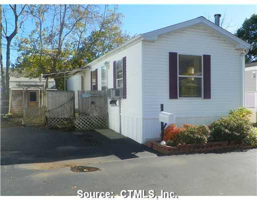 62 Fort Hill Road Groton, CT 06340 - Photo 1 of 1 a front view of a house with garden