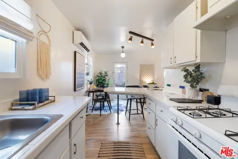 a kitchen with a table and chairs