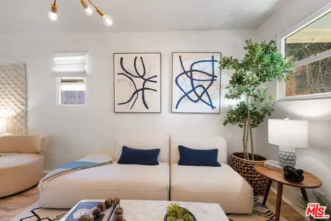 a bedroom with a bed and a lamp