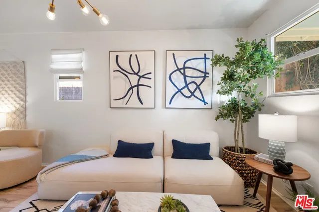 a bedroom with a bed and a lamp