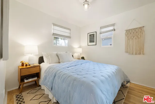 a bedroom with bed and a window