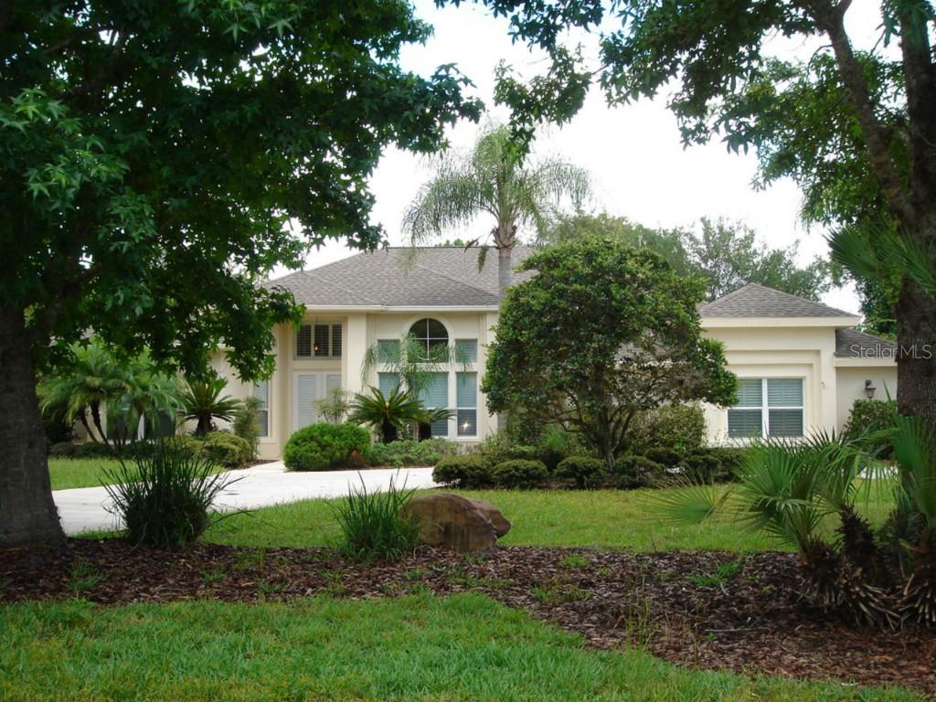 12061 Rambling Oak Boulevard Orlando, FL 32832 - Photo 1 of 1 FRONT VIEW w/CIRCULAR DRIVE