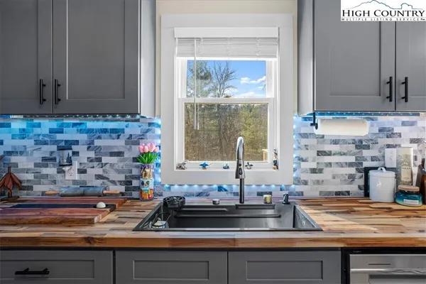 a kitchen with a sink and a stove