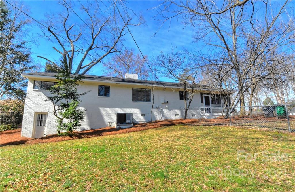 4101 Randolph Road Charlotte, NC 28211 - Photo 8 of 37 a view of a house with a large tree and a yard