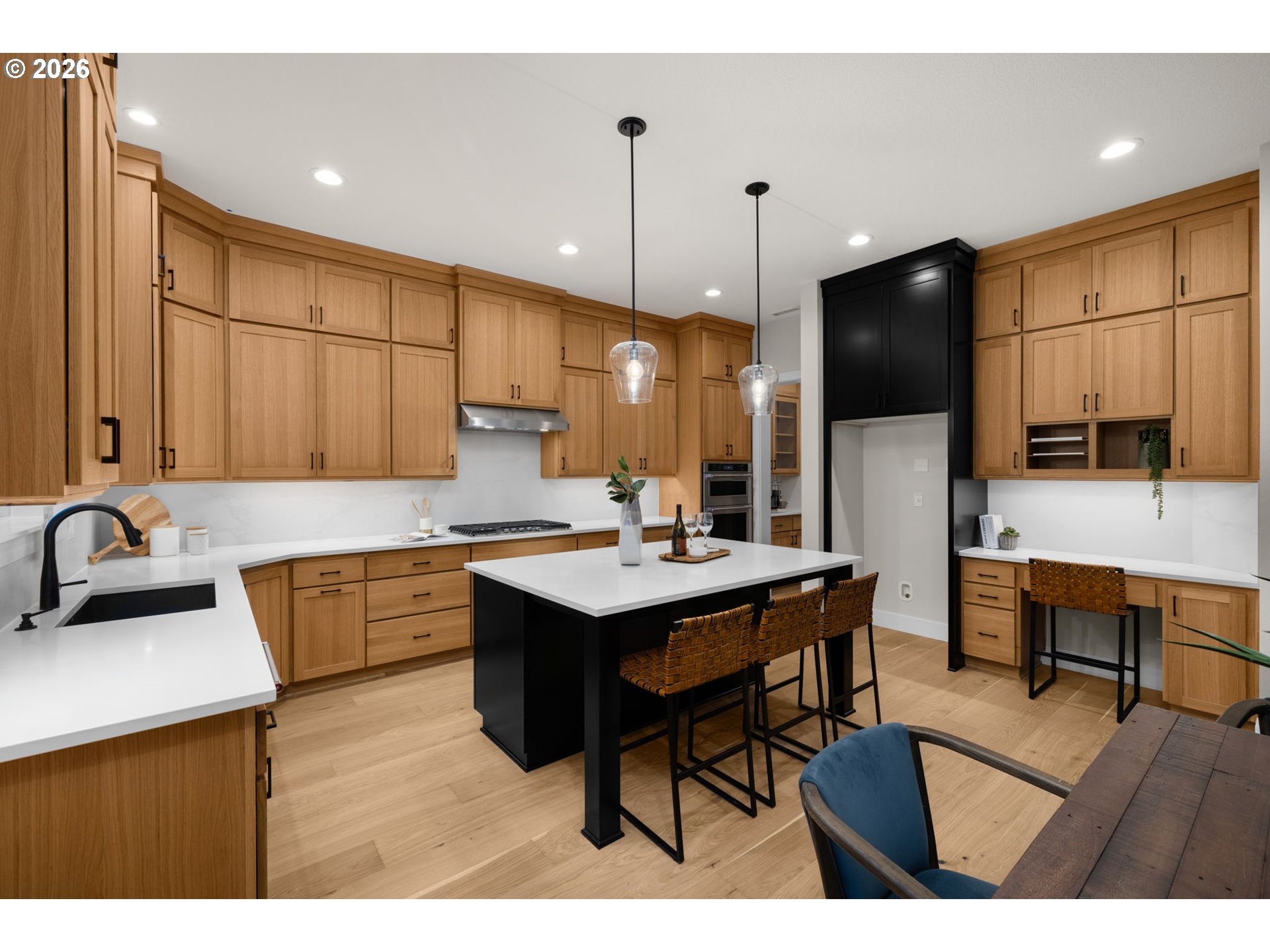17669 Northwest Layla Drive, Unit LOT 4 Portland, OR 97229 - Photo 31 of 34 a kitchen with a sink cabinets and wooden floor