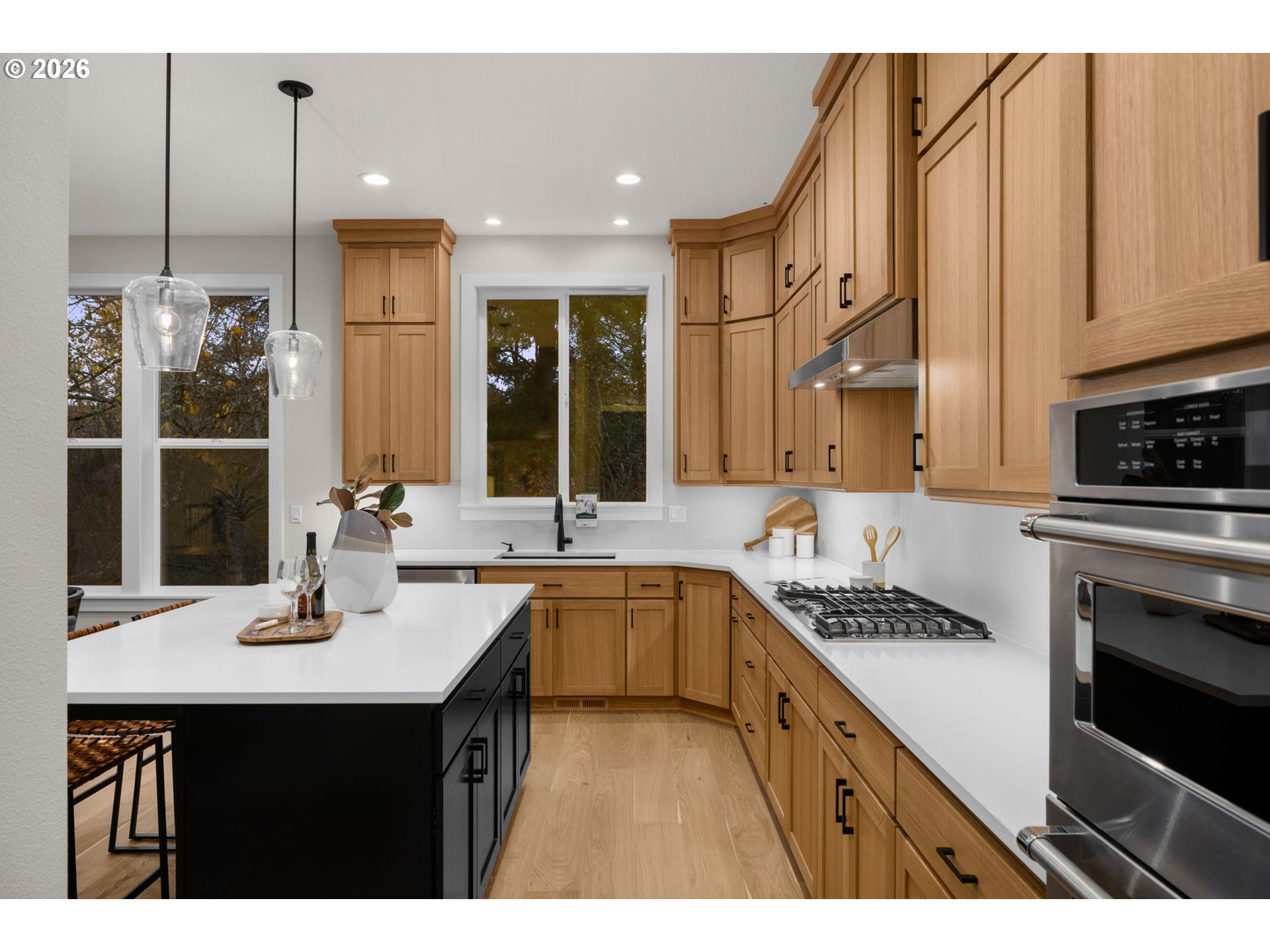 17669 Northwest Layla Drive, Unit LOT 4 Portland, OR 97229 - Photo 32 of 34 a kitchen with stainless steel appliances a sink stove and cabinets