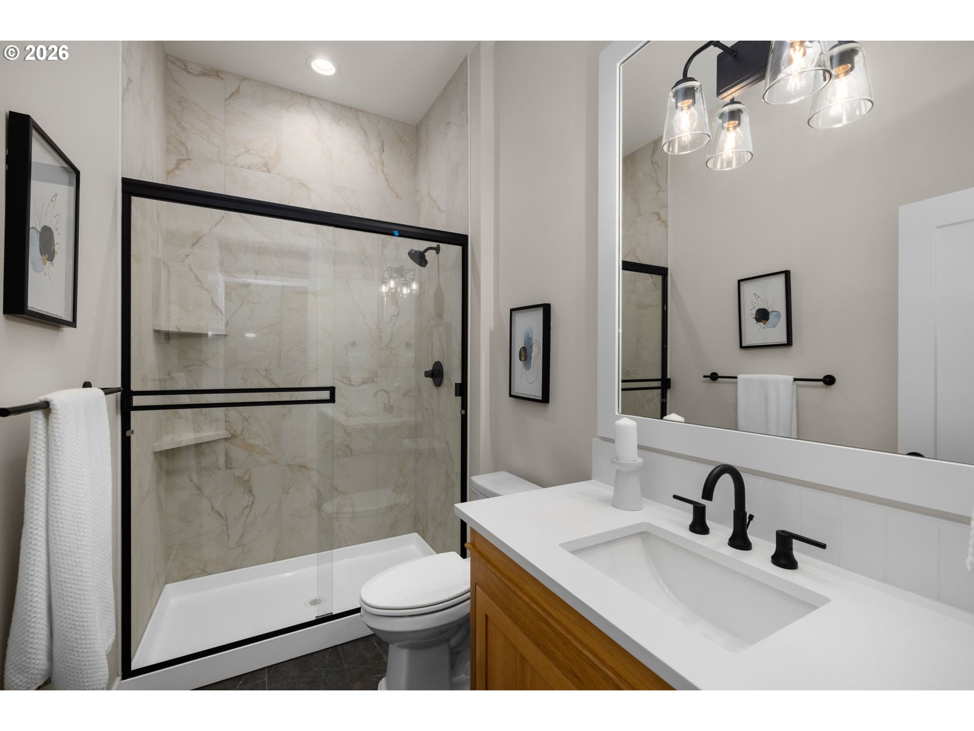 17669 Northwest Layla Drive, Unit LOT 4 Portland, OR 97229 - Photo 34 of 34 a bathroom with a sink a toilet and shower
