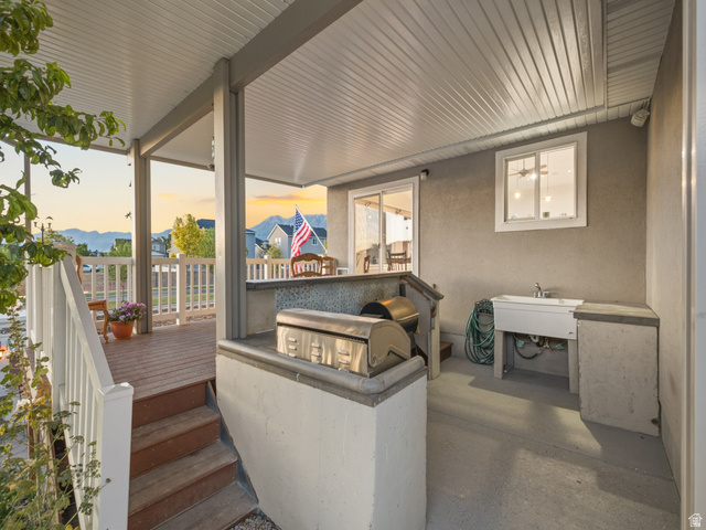 7 Sterling Loop Vineyard, UT 84059 - Photo 4 of 43 Covered outdoor patio with concrete flooring, built-in utility sink, and a grill station