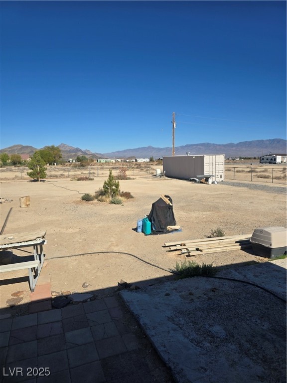4980 Retread Road Pahrump, NV 89048 - Photo 5 of 35 View of yard featuring a mountain view and a rural view