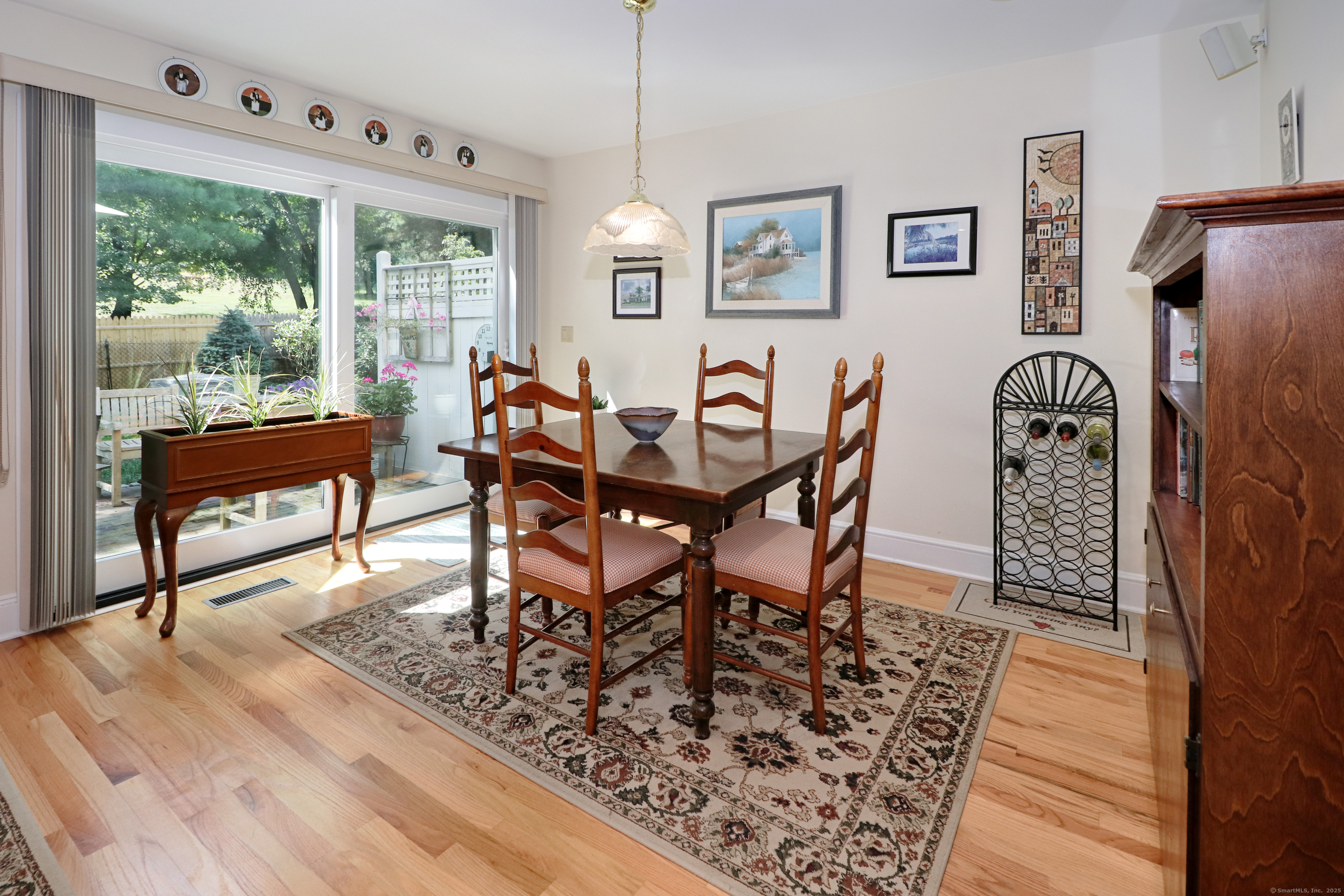 972 South Pine Creek Road, Unit 972 Fairfield, CT 06824 - Photo 13 of 37 a view of a dining room with furniture window and wooden floor