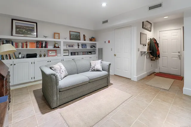 a pathway of a house with a yard