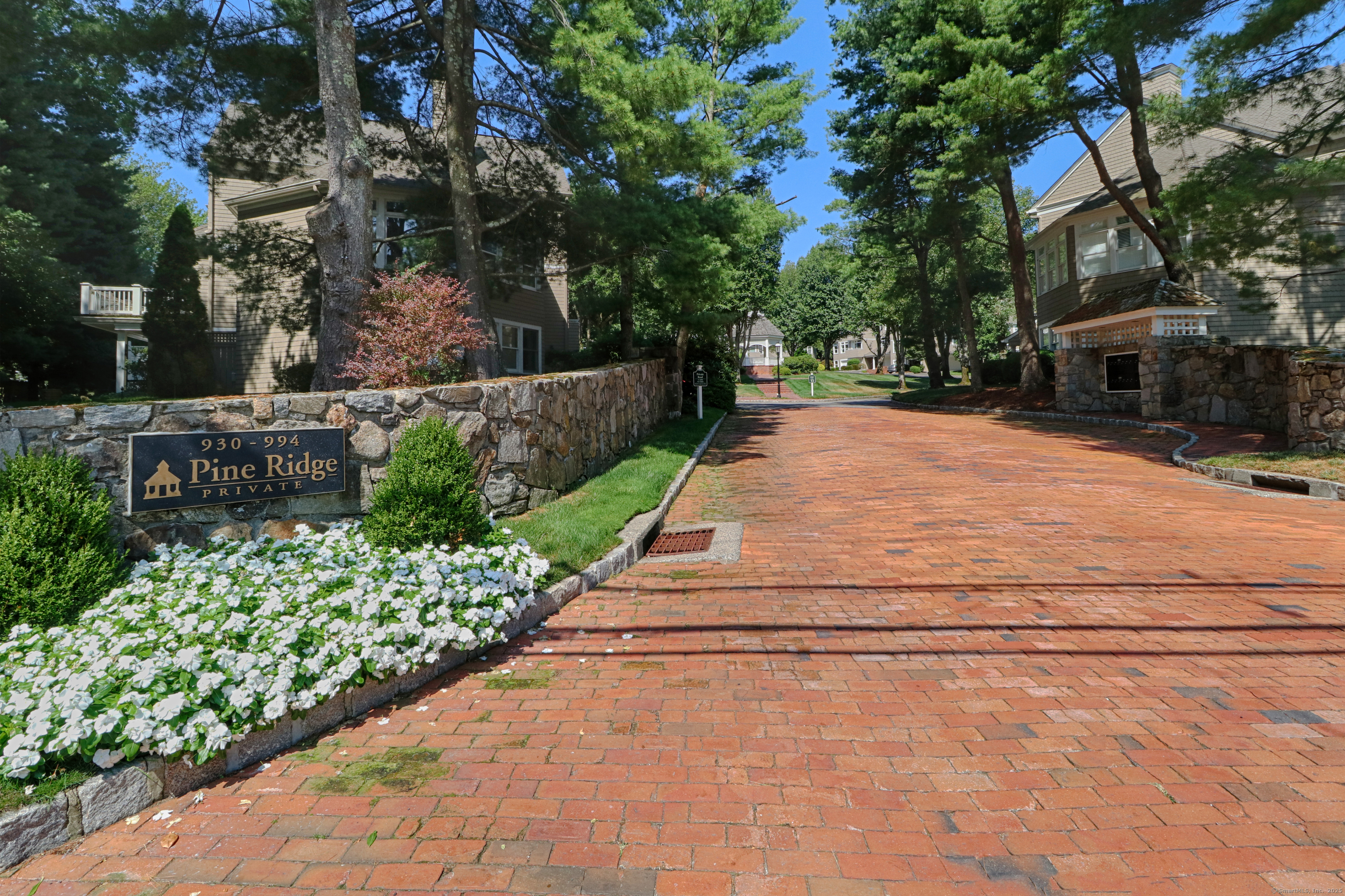 972 South Pine Creek Road, Unit 972 Fairfield, CT 06824 - Photo 29 of 37 a pathway of a house with a yard