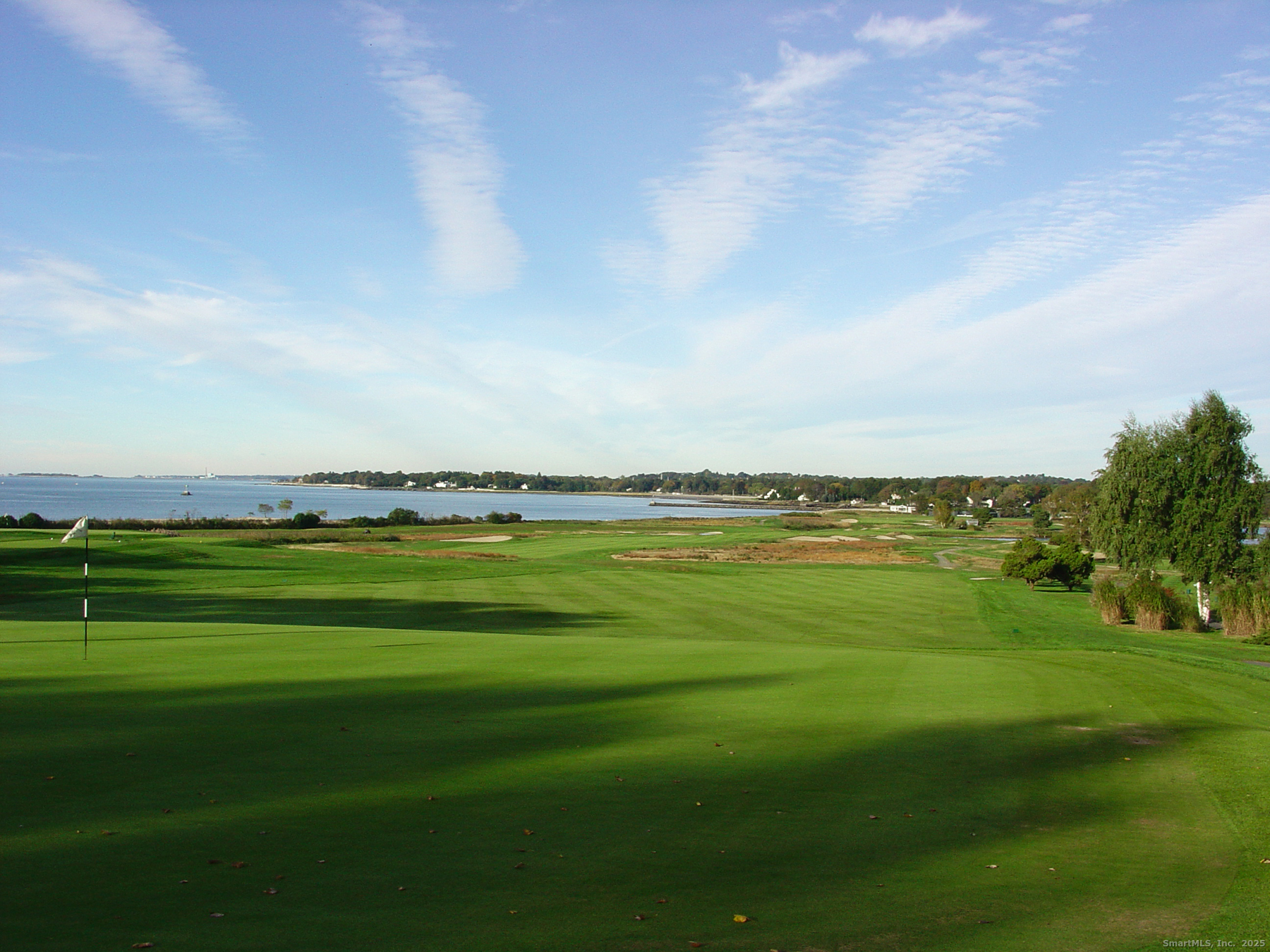 972 South Pine Creek Road, Unit 972 Fairfield, CT 06824 - Photo 35 of 37 a view of a lake with a big yard