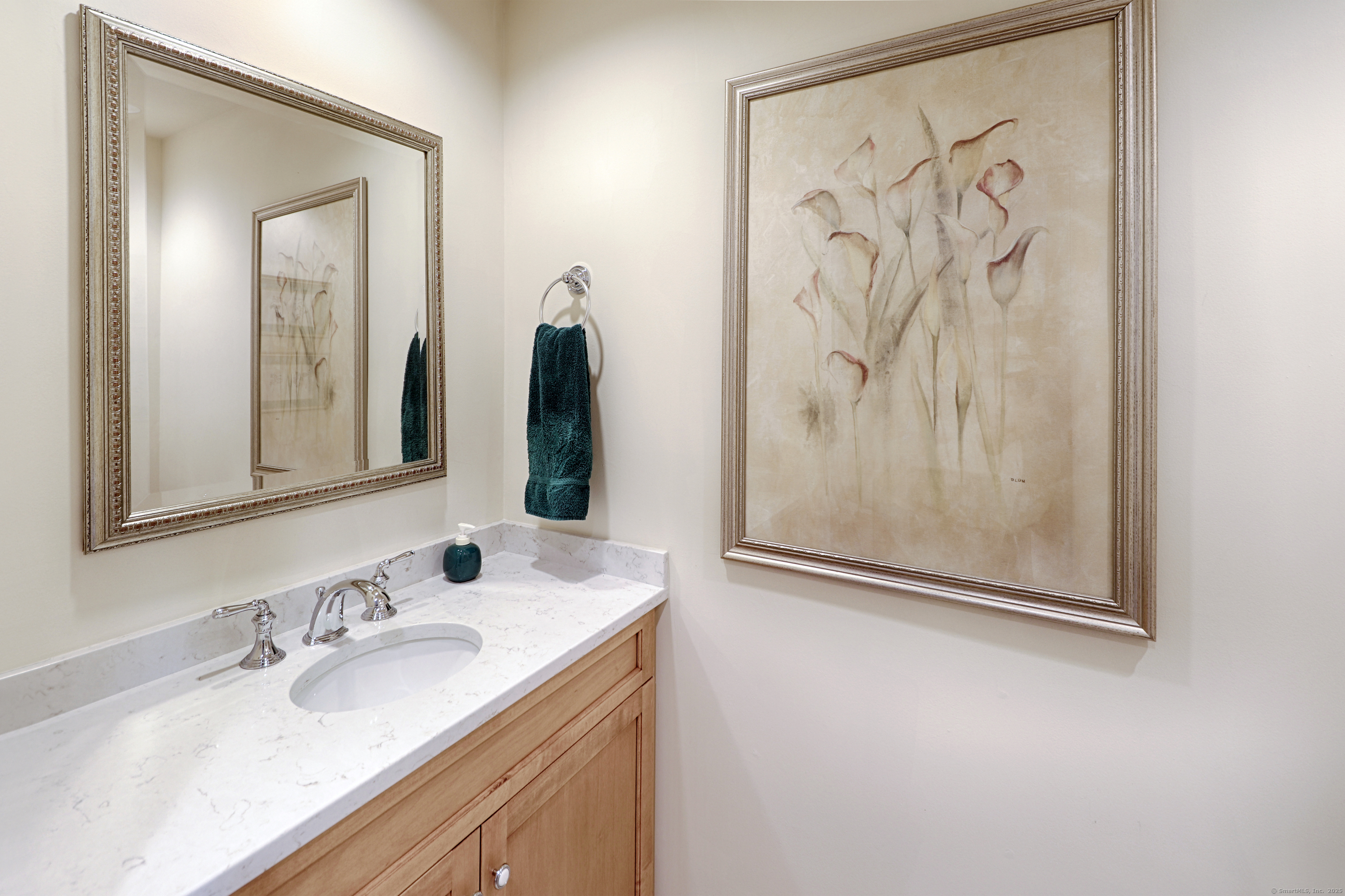 972 South Pine Creek Road, Unit 972 Fairfield, CT 06824 - Photo 10 of 37 a bathroom with a mirror sink and vanity