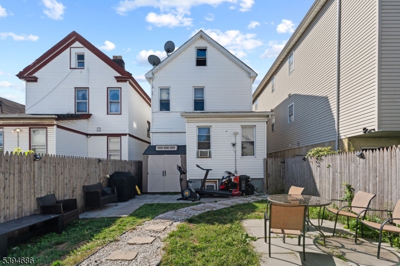 907 Flora Street Elizabeth, NJ 07201 - Photo 23 of 24 a view of house with backyard and outdoor seating