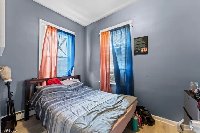 a bedroom with bed and a window