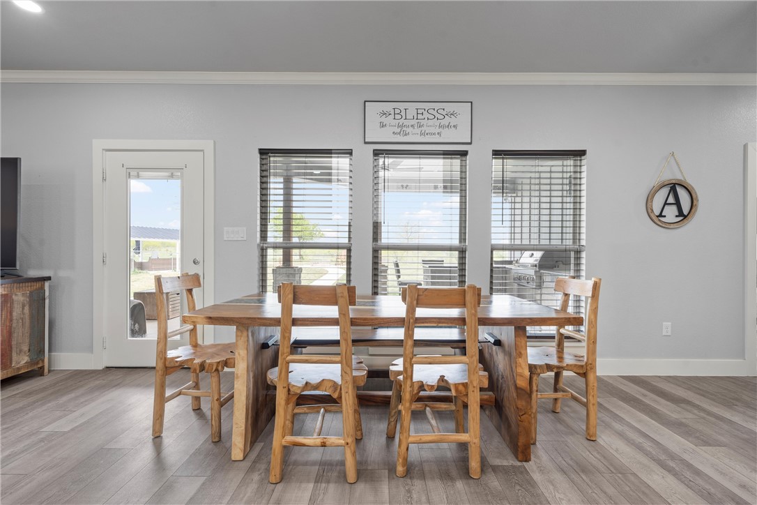 1227 Alexander Road Moody, TX 76557 - Photo 18 of 66 a view of a dining room with furniture and wooden floor